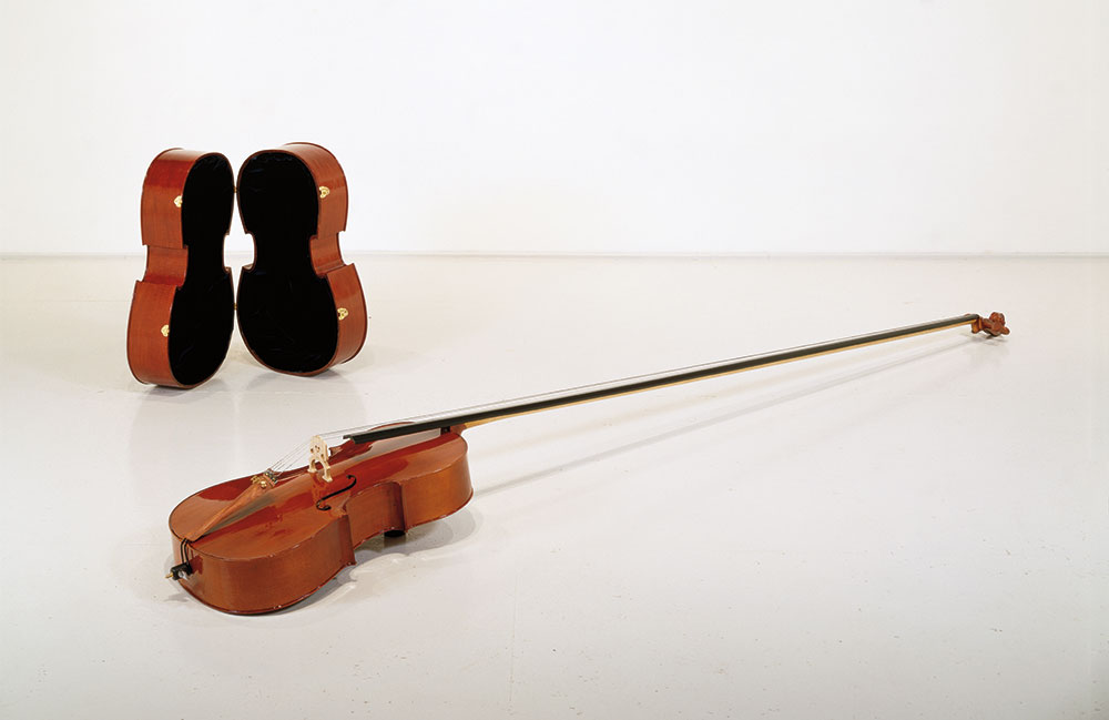 “Bravado”, 1993; Elongated cello, handmade case, Cello: 134″x18x15″ Case: 31.5″x19.5″x16″. Collection of Peter Norton